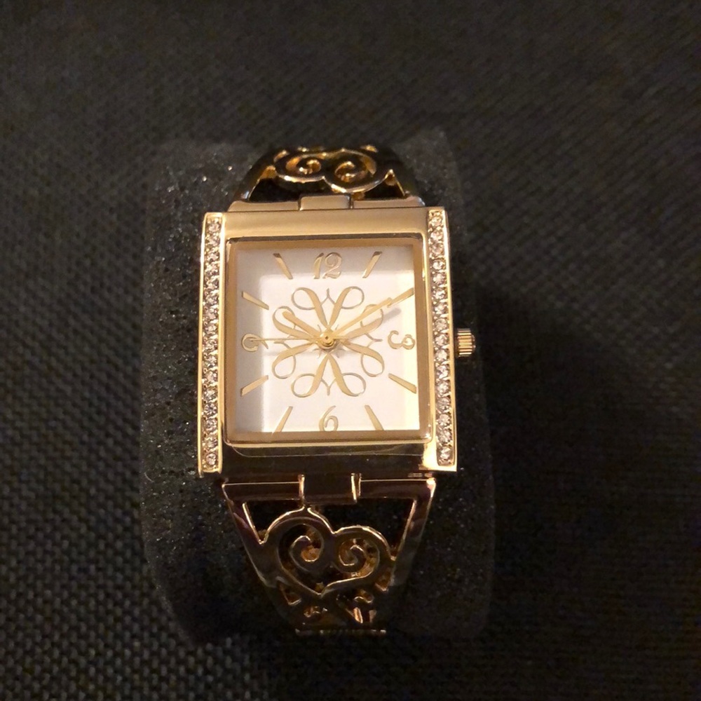 Gold cuff watch.